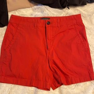 Orange size 6 flat front shorts